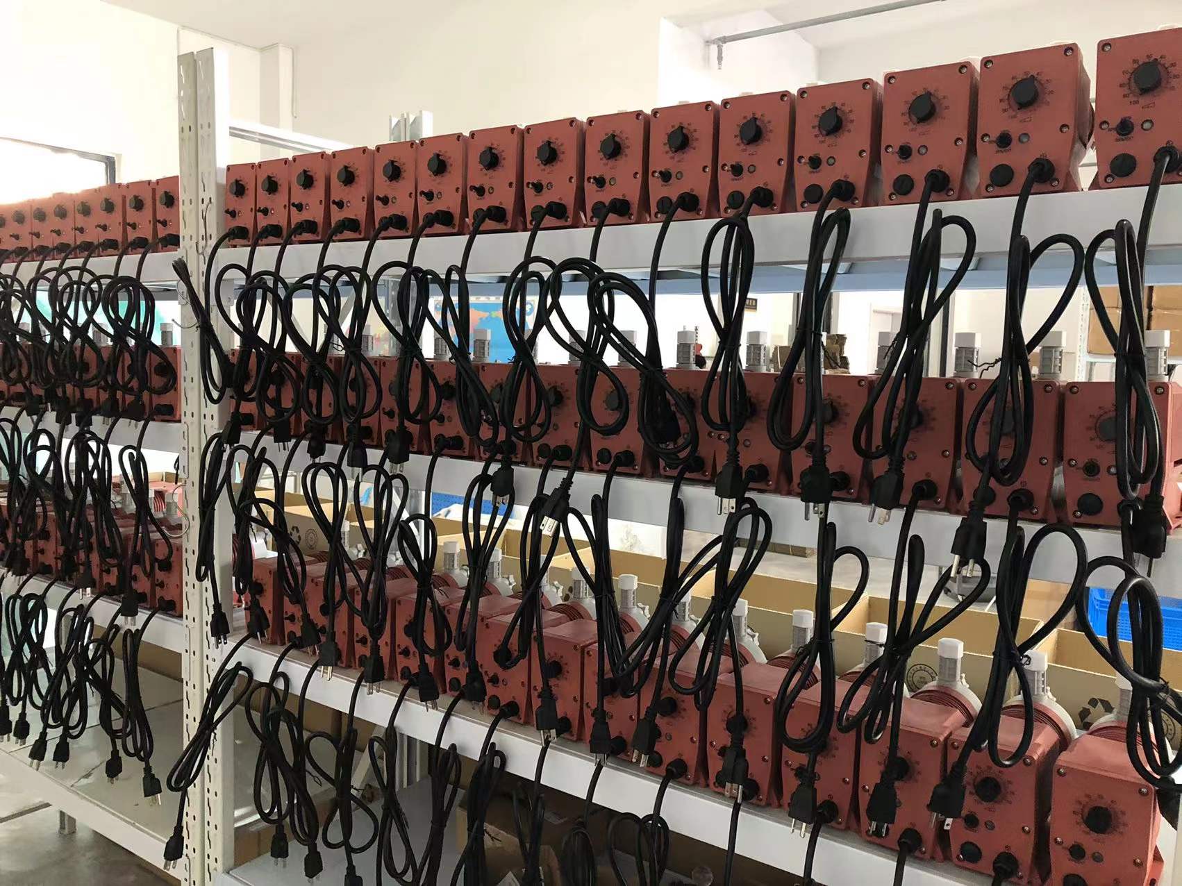 Warehouse stock — solenoid metering pumps ready for dispatch